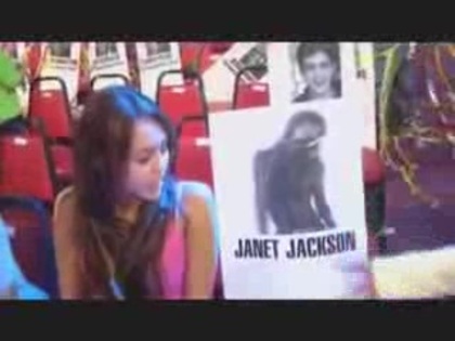 miley cyrus with a poster of Janet Jackson (3) - miley cyrus with a poster of Janet Jackson