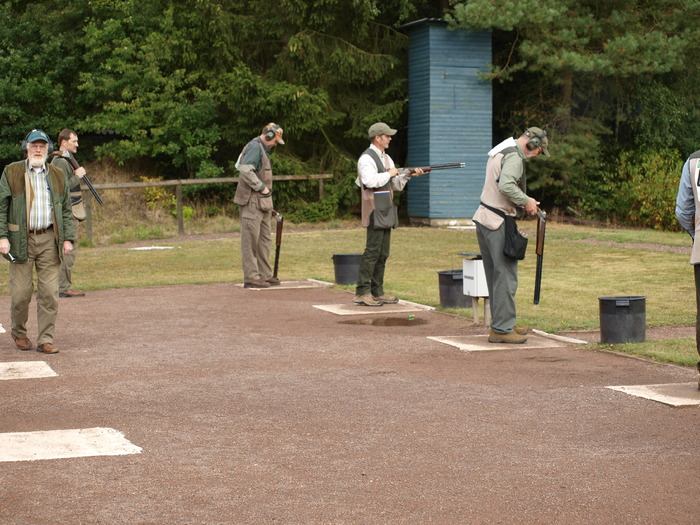 _9051370; Mark is on deck to the left. On the firing line from the left is Mike, Tom and Ed.
