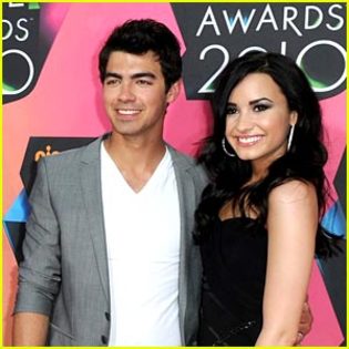 demi-lovato-joe-jonas-hiding - Demi Lovato Attends 2010 Kids Choice Awards