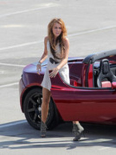 17025863_SELGYYONX - Miley Cyrus Photoshoot in a Tesla Roadster