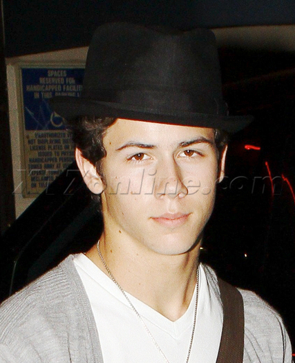 Nick-Jonas-Covers-Up-His-Curly-locks-nick-jonas-16269478-460-566 - Hiding his curly look
