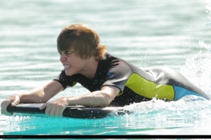 16179089_XHWMAJSAH - Justin Bieber in water with dolphin