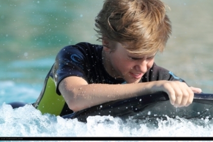 16179080_NNCXQRZOP - Justin Bieber in water with dolphin