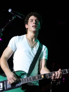95420_nick-jonas-of-jonas-brothers-performs-a-free-concert-at-irving-plaza-on-june-11-2009-in-new-yo - Nick with guitar