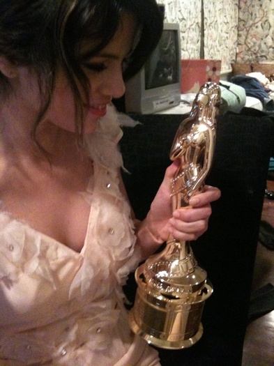 think I\'ll sleep with my dress on and award in my hand tonight. I kind of don\'t want to forget thi