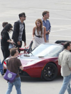 17025895_VYXKRPFJX - Miley Cyrus Photoshoot in a Tesla Roadster
