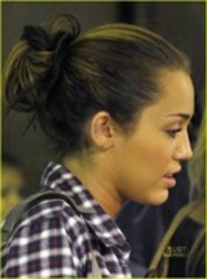 17432491_DMWIGFALN - Miley Cyrus Sports Ear Tattoo Partners with Paranormal Activity Producers