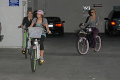15823758_BMXXXBYUA - Miley Cyrus on a Bicycle