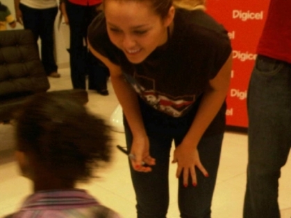 normal_001 - Signing Autographs in Haiti-miley