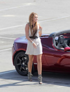 17025898_XBCFWDWUE - Miley Cyrus Photoshoot in a Tesla Roadster