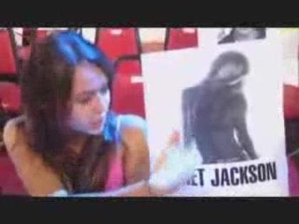 miley cyrus with a poster of Janet Jackson (2)