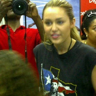 002 - Signing Autographs in Haiti-miley