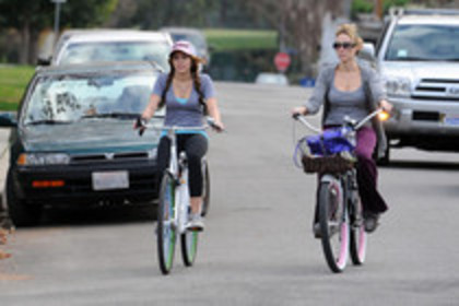 15823762_PAXVCJSZH - Miley Cyrus on a Bicycle