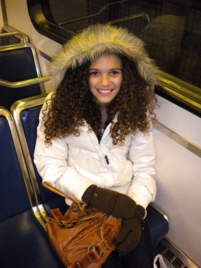 Here's a pic of me riding the Sky Train in Vancouver. I feel cool like J-LO in this jacket! LOL!