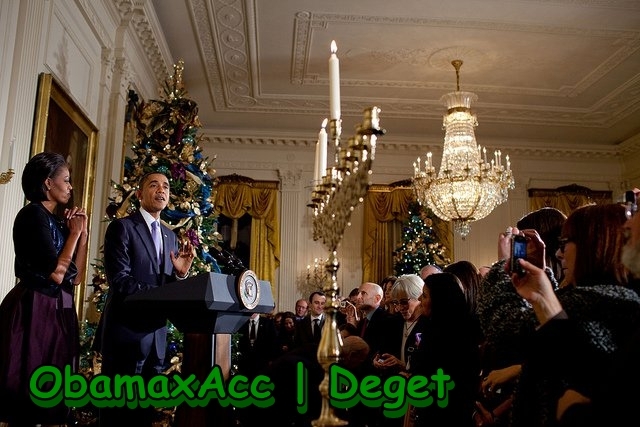 President Barack Obama and First Lady Michelle Obama take part in the Hanukkah candle lighting cerem