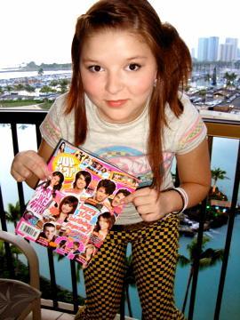 On the balcony of my hotel room is honolulu hawaii. Reading some POPSTAR Magazine