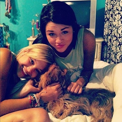 Her dog. <333 If that’s Olivia’s room »> Damn so many trophies!