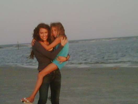 with my sis miley on beach...