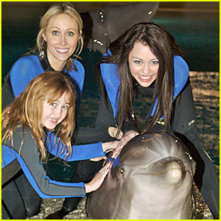 me ,nohx n mom with a dolphin