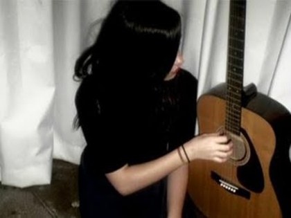 Me singing at the guitar