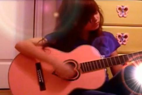 Here I am with my guitar..My old guitar..I miss Erniiee(my old guitar) :]]