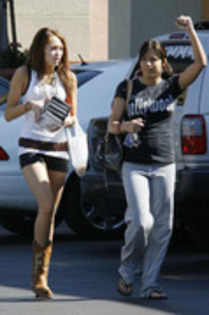 17469560_WEQRCACQF - miley cyrus and mandy jiroux Leaving Blockbuster in Hollywood March 10 2008