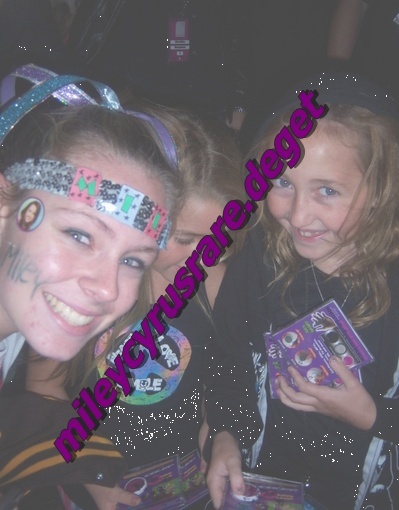 with fan at miley concert