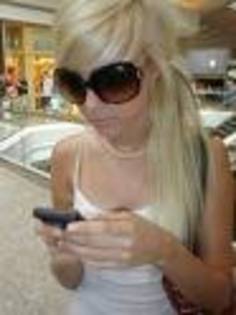 ME LEAH; me at the mall texting.. i didnt no my friend took this pic.. haha
