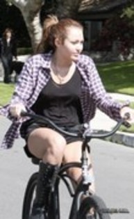 26264029_GJMUDRMEH - x Riding Her Bike in Toluca Lake