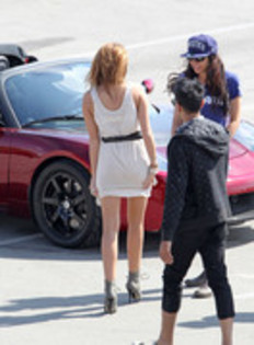 17025902_UHFRCEPNV - Miley Cyrus Photoshoot in a Tesla Roadster