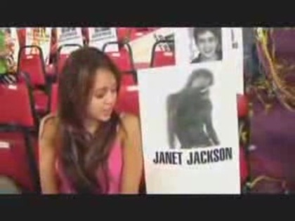 miley cyrus with a poster of Janet Jackson (7) - miley cyrus with a poster of Janet Jackson
