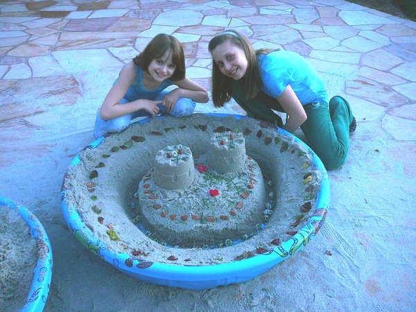 we made a sandcastle in a kiddy pool!! I LOVE FRIDAYS!! - me