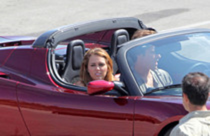 17025900_YZIPFETAQ - Miley Cyrus Photoshoot in a Tesla Roadster