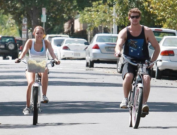 Miley+Cyrus+Liam+Hemsworth+Riding+Their+Bikes+9NIYM7ij0Bel - Riding their bikes