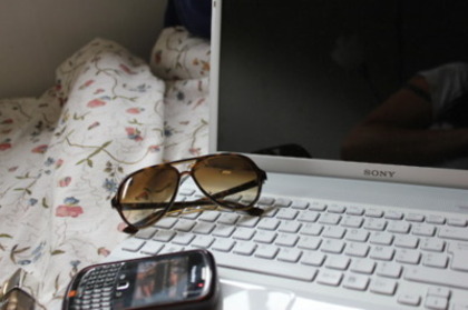 laptop,sunglasess and blackberry