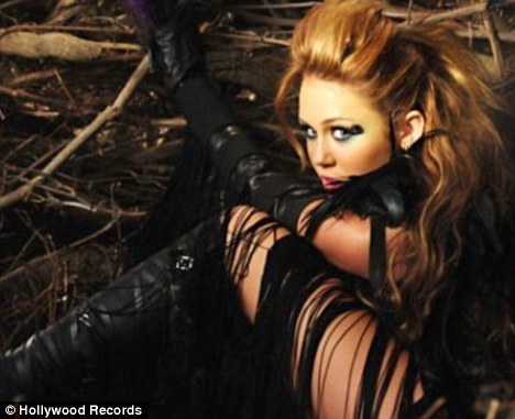 article-0-096FF67C000005DC-889_468x381 - Miley Cyrus Cant Be Tamed