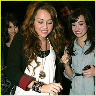miley-selena-demi-koi-restaurant - Demi Lovato and Miley Cyrus