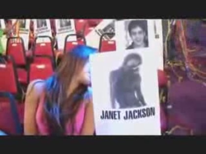 miley cyrus with a poster of Janet Jackson (5)