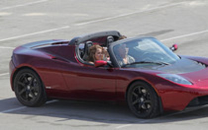 17025861_RMLIHDFSX - Miley Cyrus Photoshoot in a Tesla Roadster