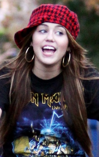 Miley Cyrus wearing an Iron Maiden T-shirt