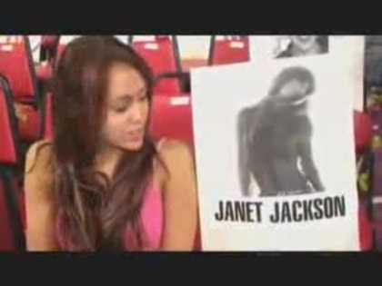 miley cyrus with a poster of Janet Jackson (9)