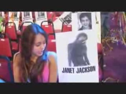 miley cyrus with a poster of Janet Jackson (4) - miley cyrus with a poster of Janet Jackson