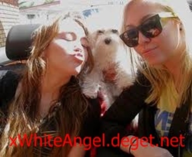 Miley and dog and sister