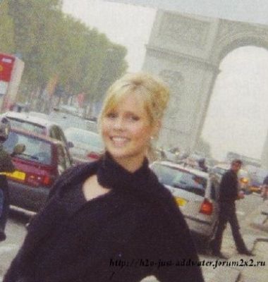 me and behind the Arc de Triomphe