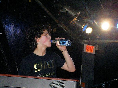 Nick Jonas wearing smet and drinking water rare