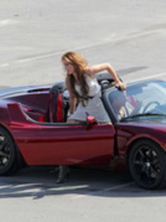 17025859_FHAIOPEHI - Miley Cyrus Photoshoot in a Tesla Roadster