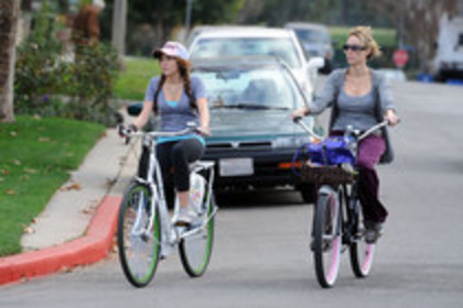 15823759_ZSYYAGUHG - Miley Cyrus on a Bicycle