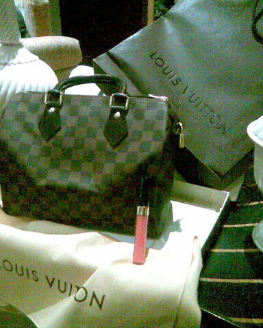 my BIG purchase today...LV purse and Chanel lip gloss...2 things a girl can\'t live without!!lol