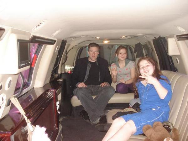 My dad, my little sister and I hanging out in the limo!