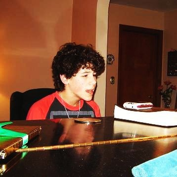 Younger Nick playing piano